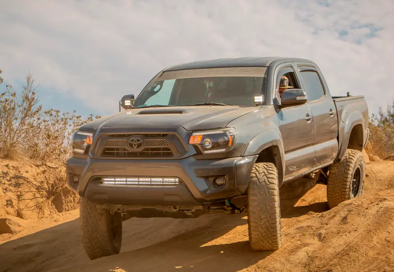Cali Raised Low-Profile Led Ditch Light Brackets For 2005–2015 Toyota Tacoma – Small Size With Blue Backlight 1
